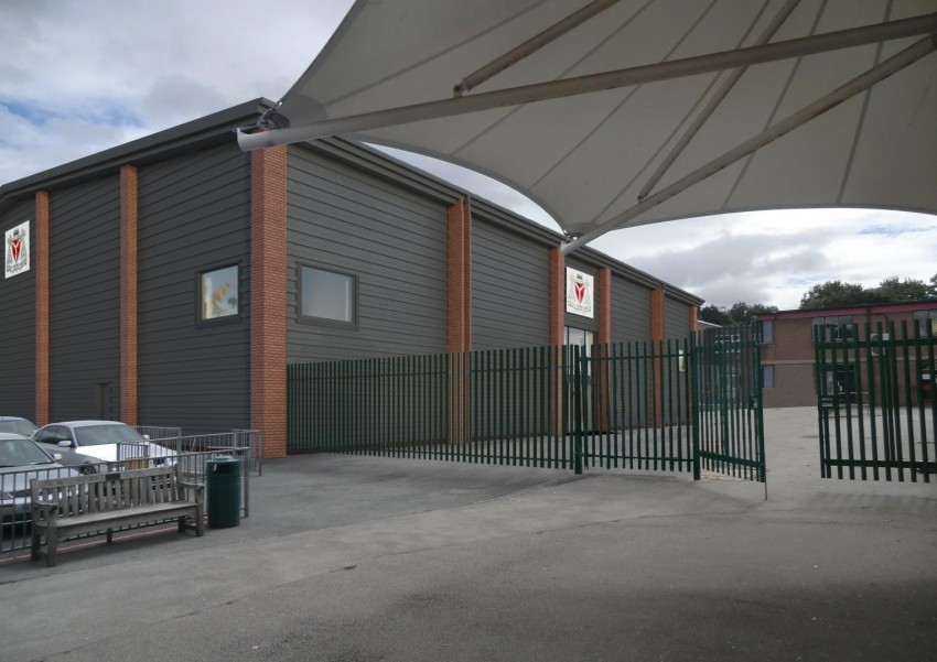 An exterior shot of the school sports hall where you can see the canopy and the outside of the building.