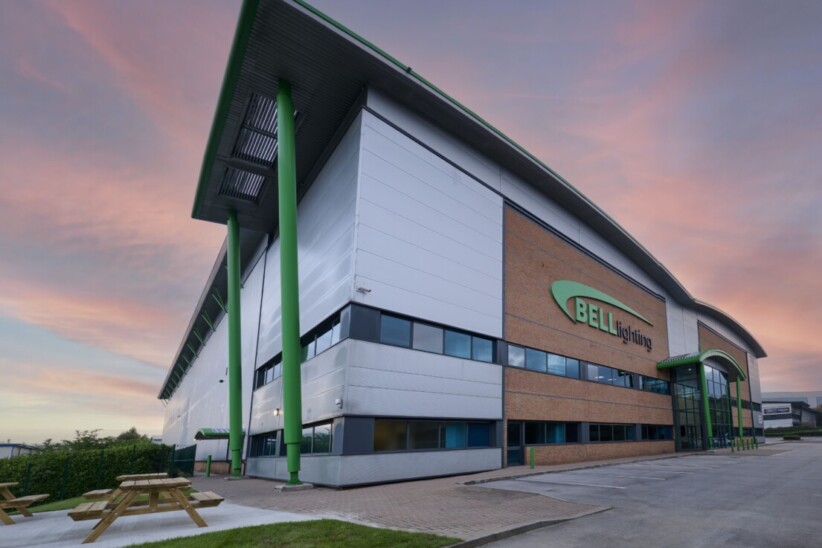 A picture showing Bell House which is the building of Bell Lighting. It is an outside shot of the building with the reception in view and the logo on the side of the building. Bell Lighting is based in Normanton, Wakefield.