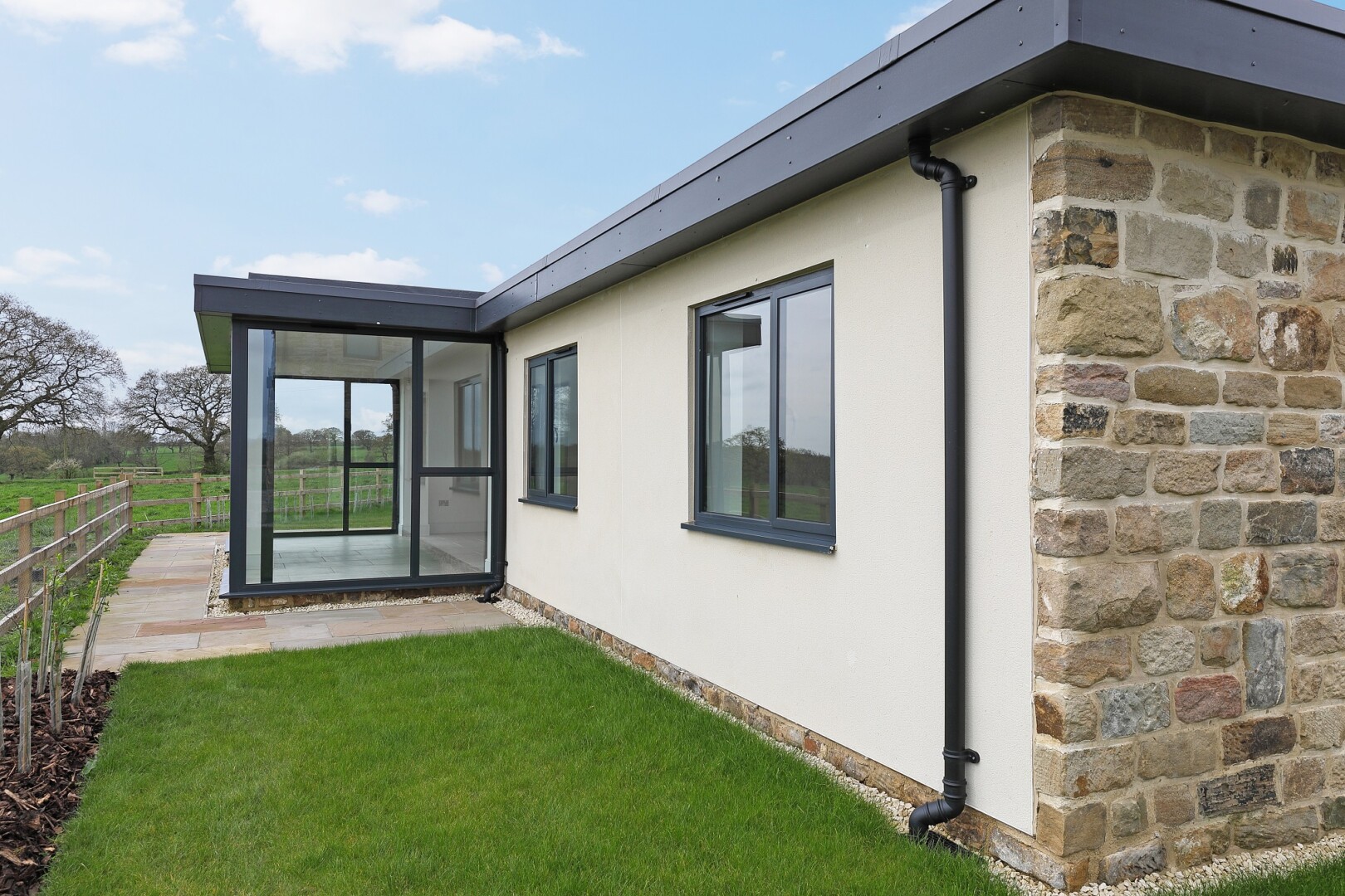 Photograph of Fairview House, the converted bungalow at Flying Horse Farm in Scholes. The image shows an rear view of the property.