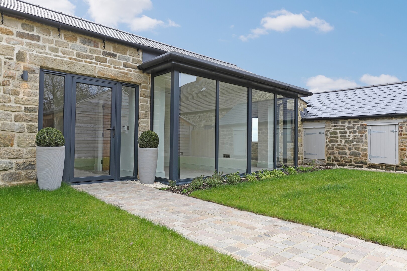 Photograph of Fairview House, the converted bungalow at Flying Horse Farm in Scholes. The image shows the front entrance of the property.